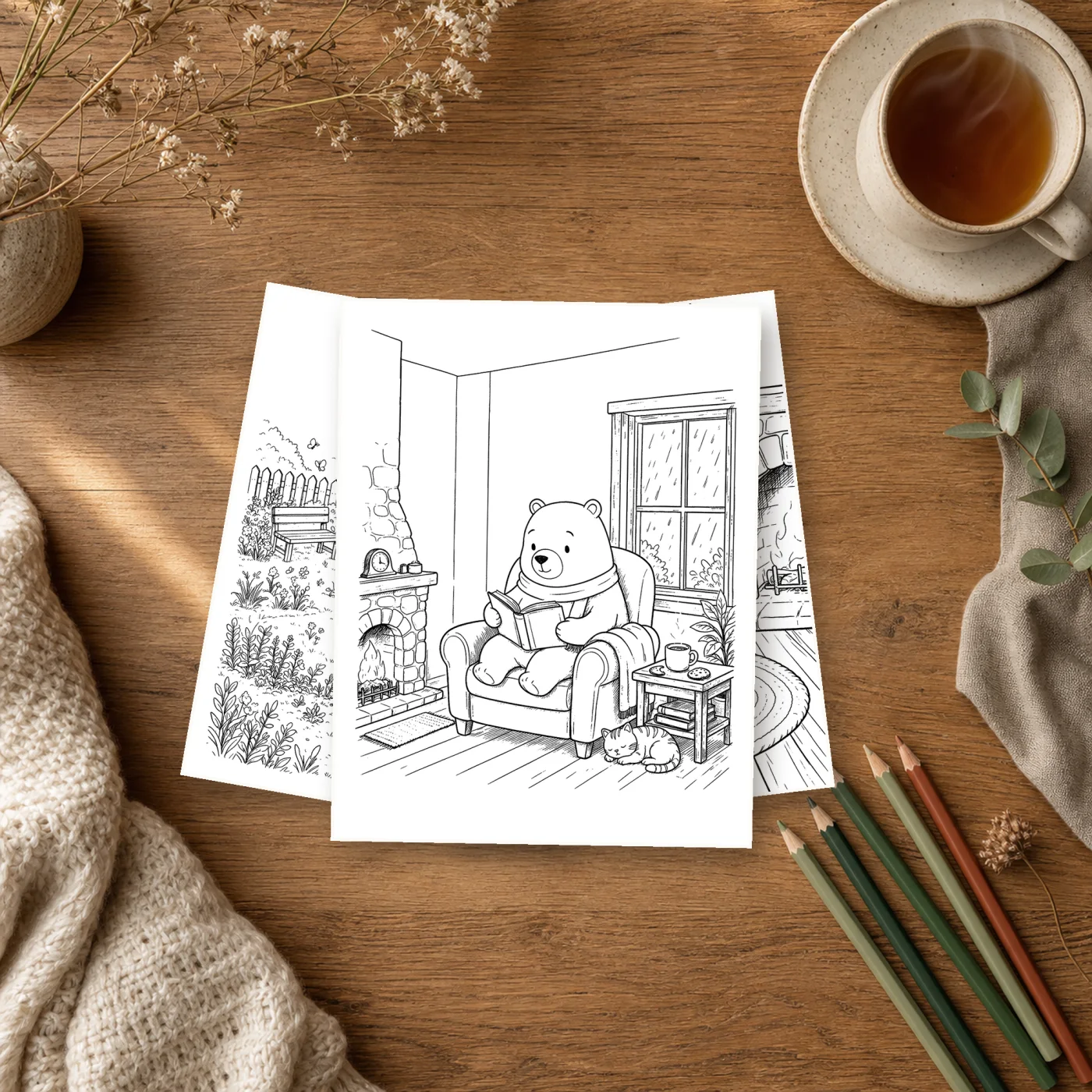 Printed coloring pages from Slow Hours with Oliver arranged beside pencils